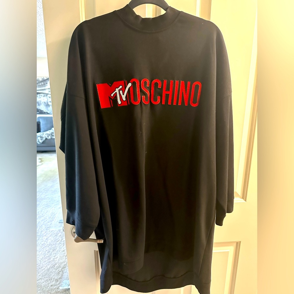 Moschino for H&M black sweatshirt material. Great in winter with high boots!
